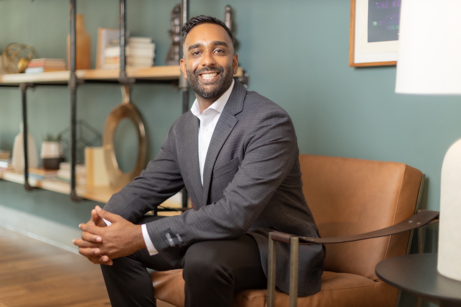 Jas Goraya, who runs Coffee Break Labs, sitting in an office lounge